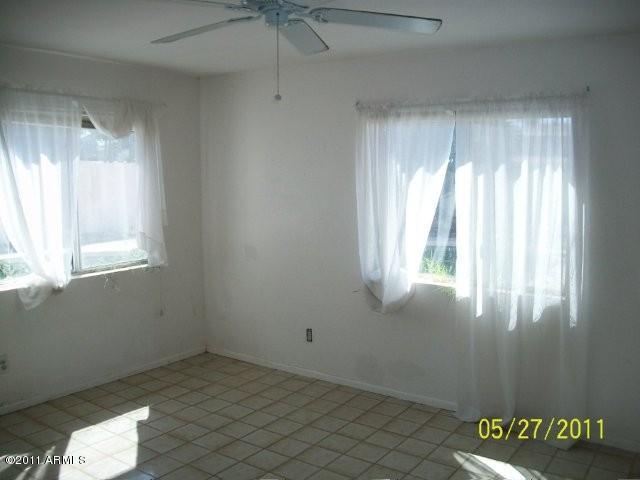 1831 West Decatur Street Mesa, AZ 85201 - Photo 7 of 10 an empty room with windows