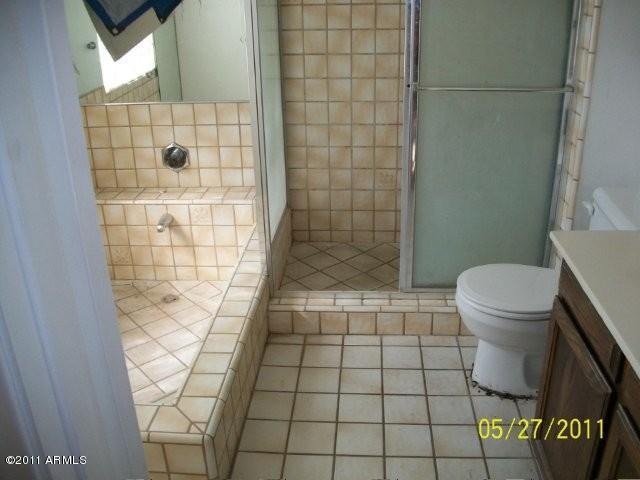 1831 West Decatur Street Mesa, AZ 85201 - Photo 8 of 10 a bathroom with a toilet and a shower
