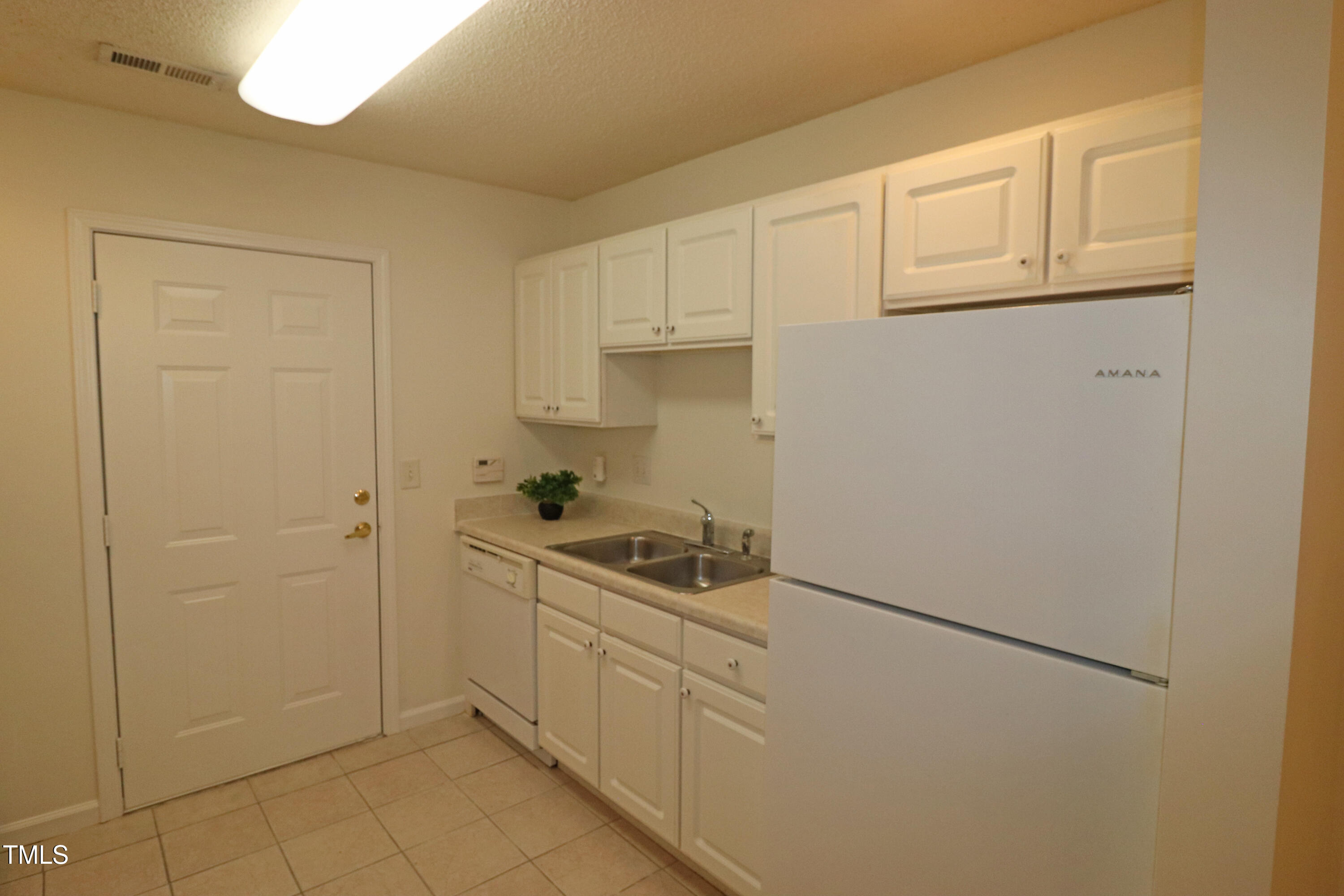 11321 Involute Place, Unit 102 Raleigh, NC 27617 - Photo 14 of 37 Kitchen by garage
