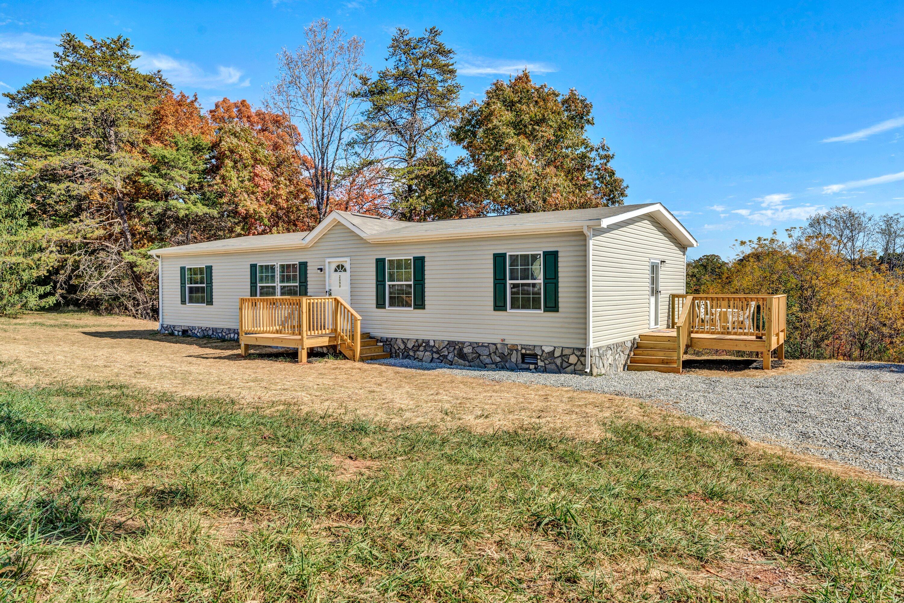 2098 Lipscomb Road Moneta, VA 24121 - Photo 1 of 27 a view of a house with a patio