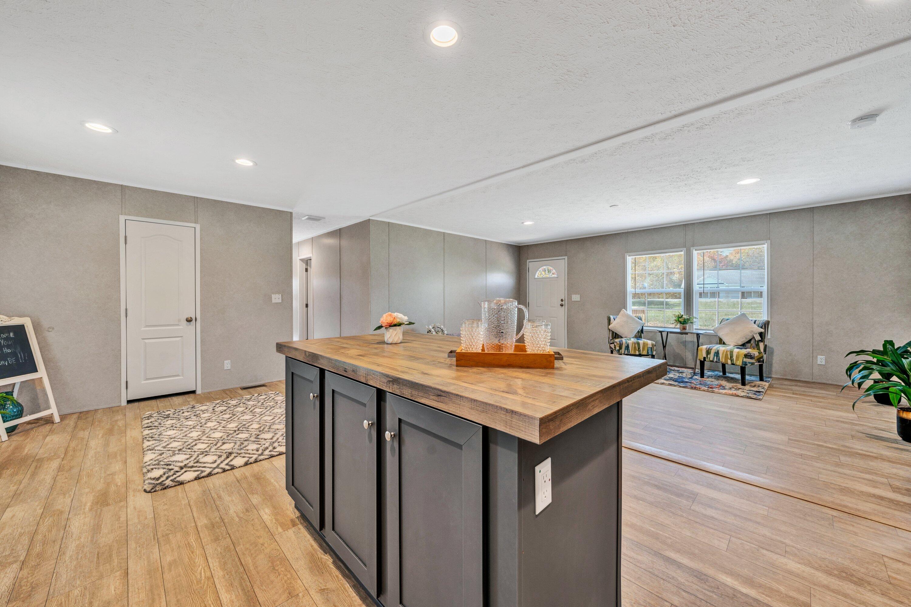 2098 Lipscomb Road Moneta, VA 24121 - Photo 11 of 27 a room with furniture and wooden floor