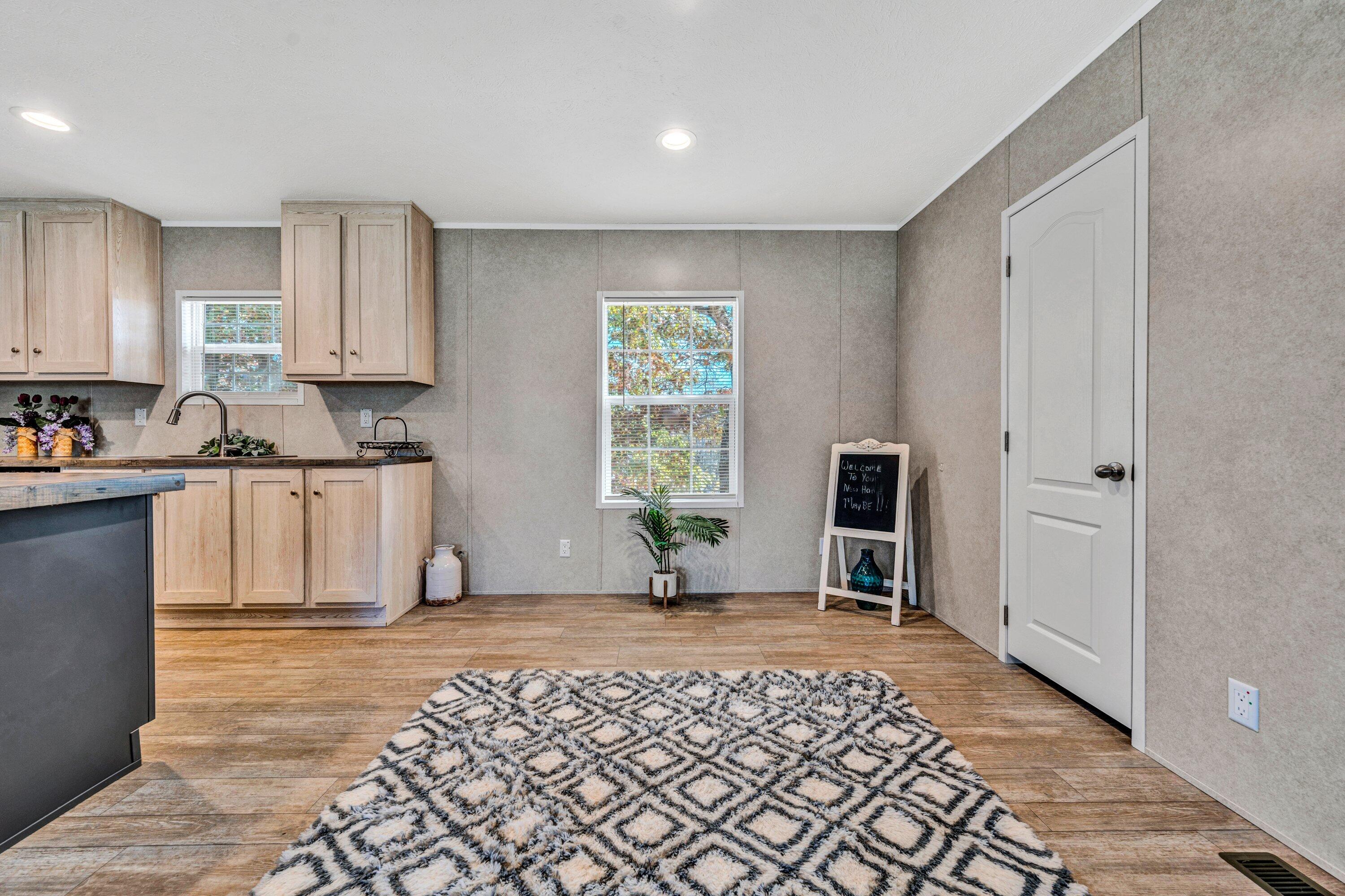 2098 Lipscomb Road Moneta, VA 24121 - Photo 12 of 27 a view of a kitchen with wooden floor and a sink