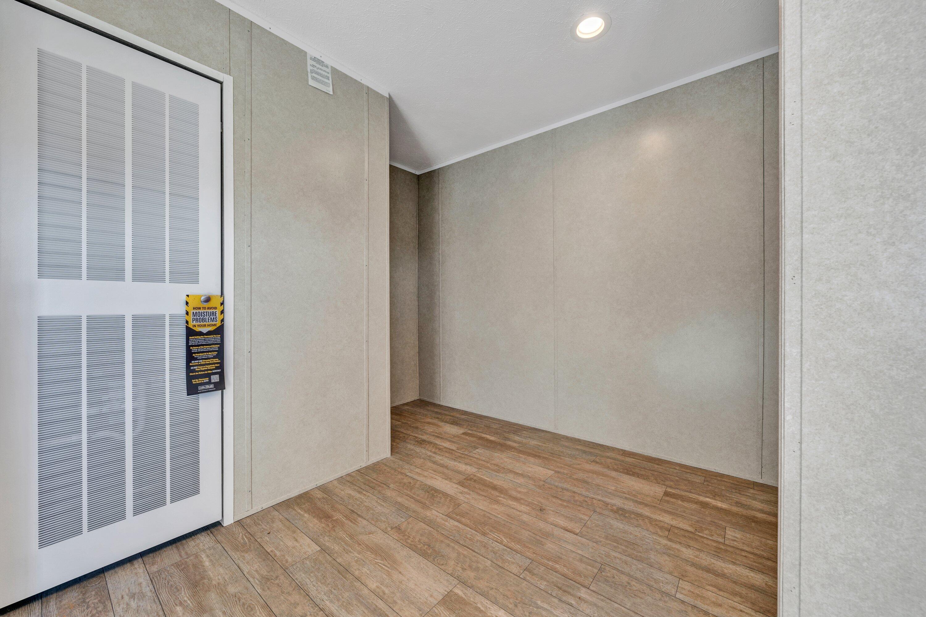 2098 Lipscomb Road Moneta, VA 24121 - Photo 17 of 27 a view of an empty room with wooden floor and a window