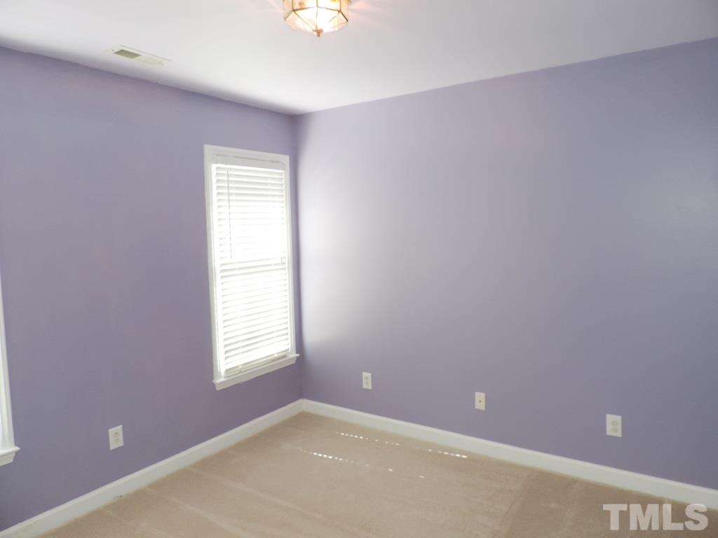 1901 Crag Burn Lane Raleigh, NC 27604 - Photo 13 of 16 an empty room with a window