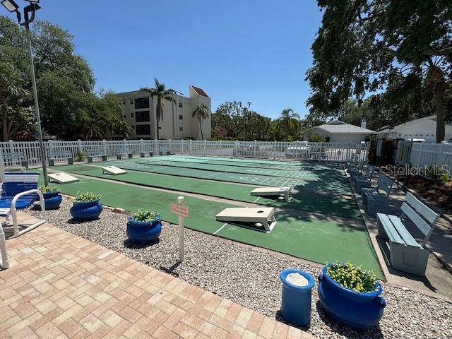 11485 Oakhurst Road, Unit 319 Largo, FL 33774 - Photo 56 of 63 a view of a backyard with sitting area and garden