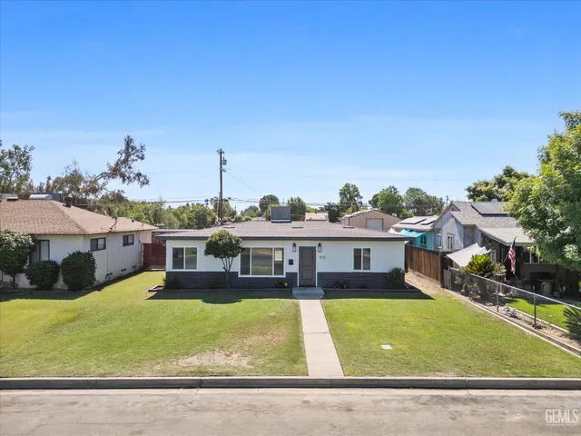 an aerial view of a house with swimming pool