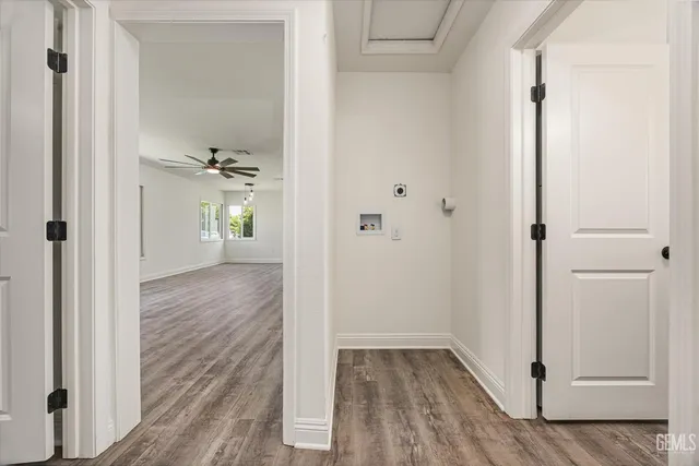 wooden floor with white walls