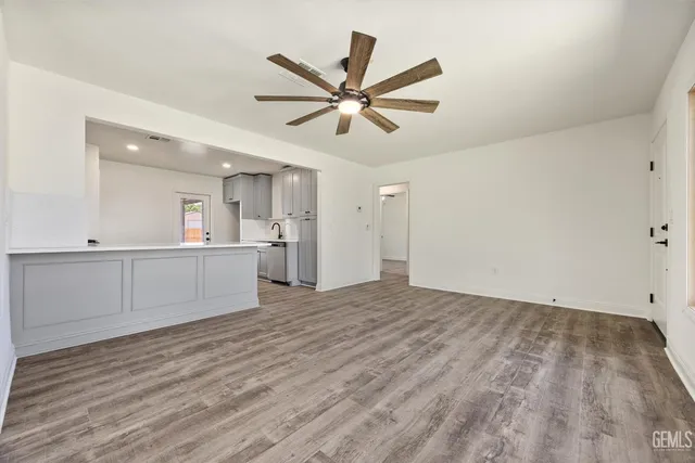 a view of a kitchen with a sink and cabinets