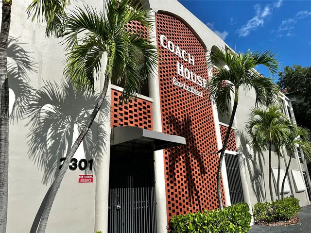 a view of a palm trees in front of a house