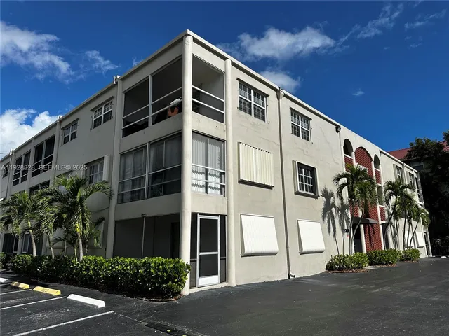 a front view of a building with a street