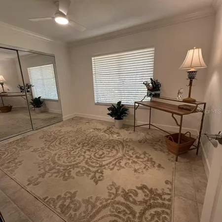 a bedroom with furniture and a window