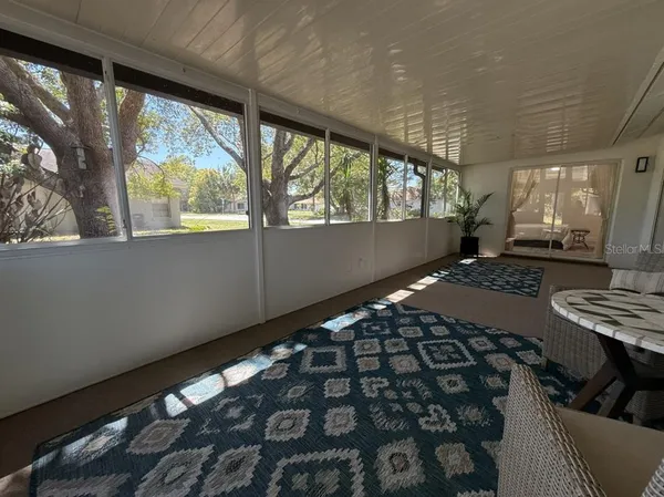 a bed sitting in a room next to a window