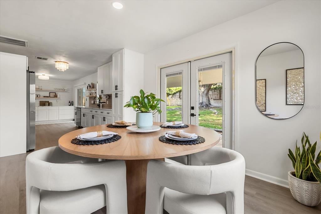 611 Bryan Court Altamonte Springs, FL 32701 - Photo 18 of 37 a kitchen with a table and chairs in it