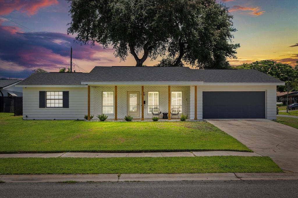 611 Bryan Court Altamonte Springs, FL 32701 - Photo 2 of 37 a front view of a house with a garden