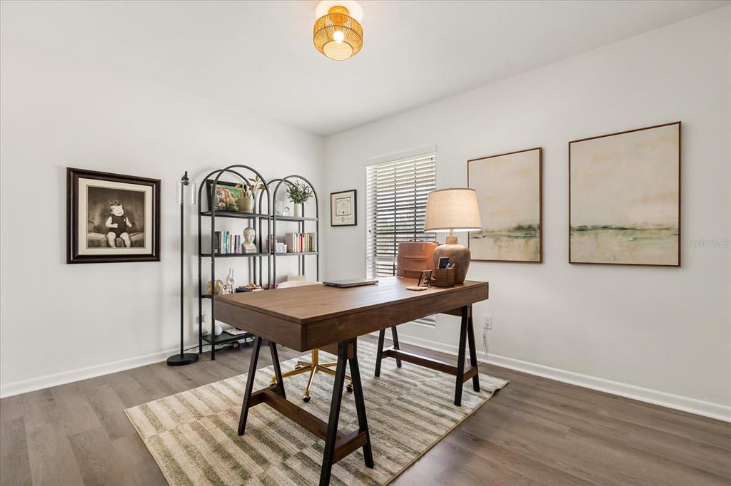 611 Bryan Court Altamonte Springs, FL 32701 - Photo 21 of 37 a view of a workspace with furniture and wooden floor
