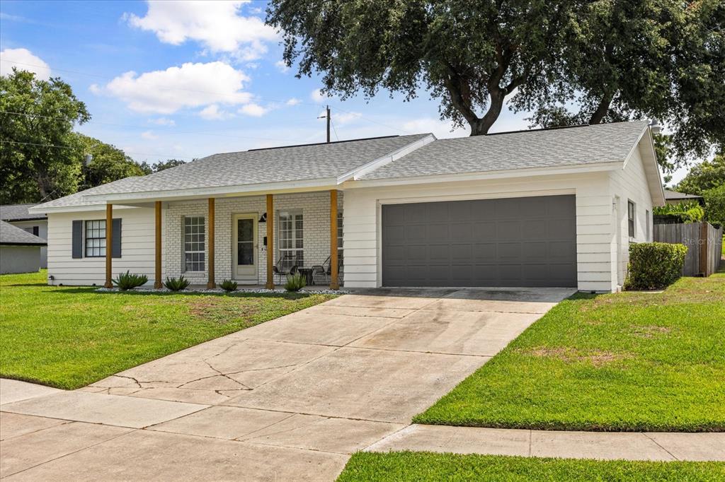 611 Bryan Court Altamonte Springs, FL 32701 - Photo 3 of 37 a front view of a house with a garden and yard
