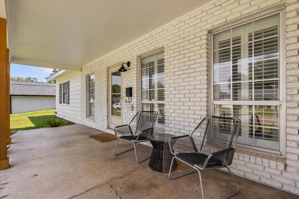 611 Bryan Court Altamonte Springs, FL 32701 - Photo 6 of 37 a view of a house with backyard porch and sitting area
