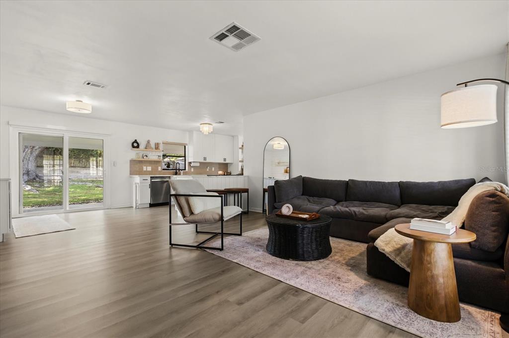 611 Bryan Court Altamonte Springs, FL 32701 - Photo 7 of 37 a living room with furniture and a table