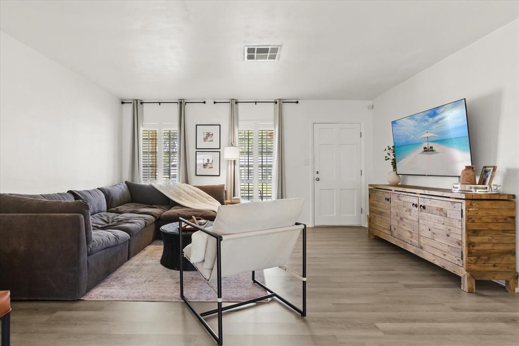 611 Bryan Court Altamonte Springs, FL 32701 - Photo 8 of 37 a living room with furniture and wooden floor