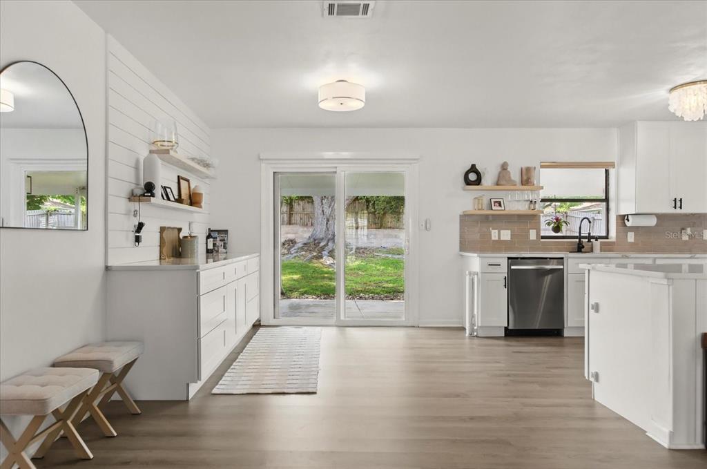 611 Bryan Court Altamonte Springs, FL 32701 - Photo 10 of 37 a kitchen with a sink cabinets and wooden floor