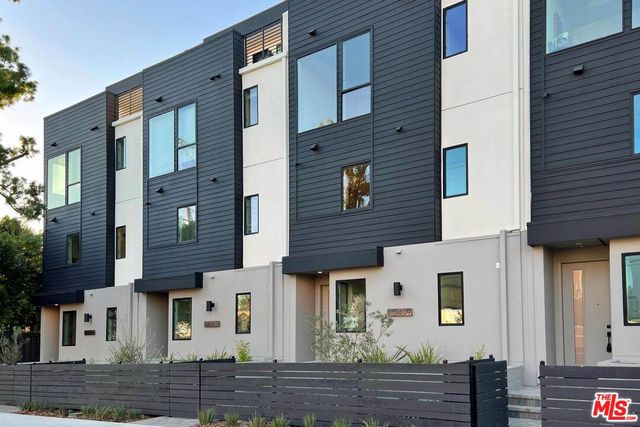 a front view of a house with wooden stairs
