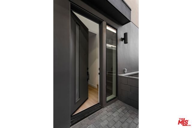 a picture of a bathroom with a shower and a sink