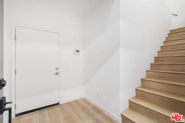 a view of entryway with wooden floor