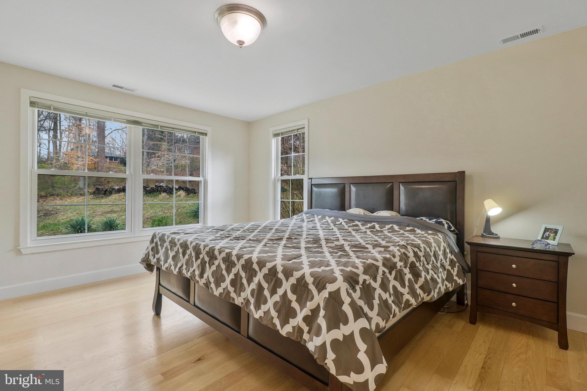 8543 Howell Road Bethesda, MD 20817 - Photo 15 of 24 a bedroom with a large bed and a large window