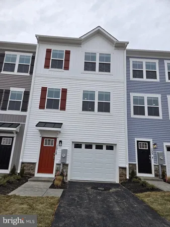 a view of a brick house with many windows
