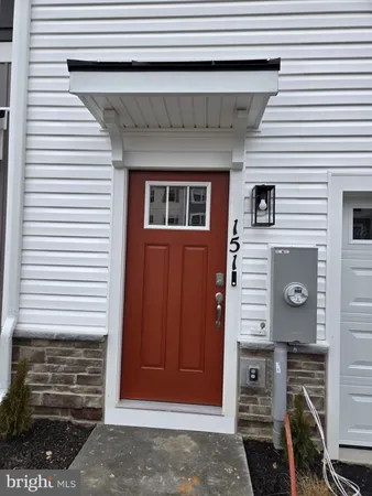a front view of a house with stairs