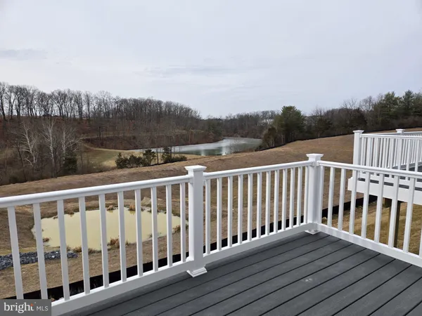 a view of wooden deck and city view