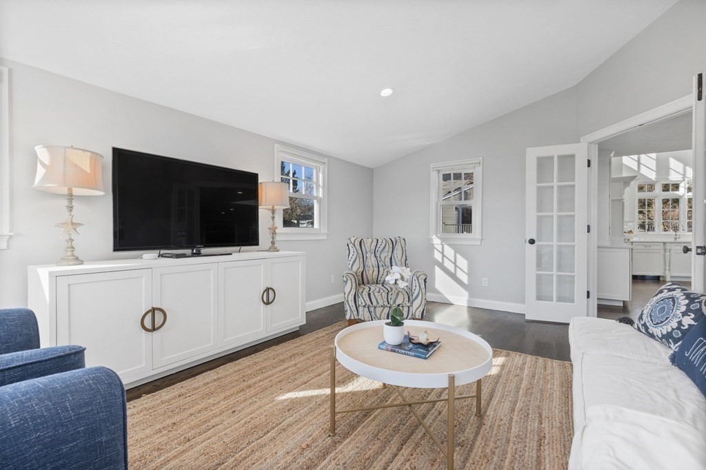 48 Collier Road Scituate, MA 02066 - Photo 19 of 42 a living room with furniture and a flat screen tv