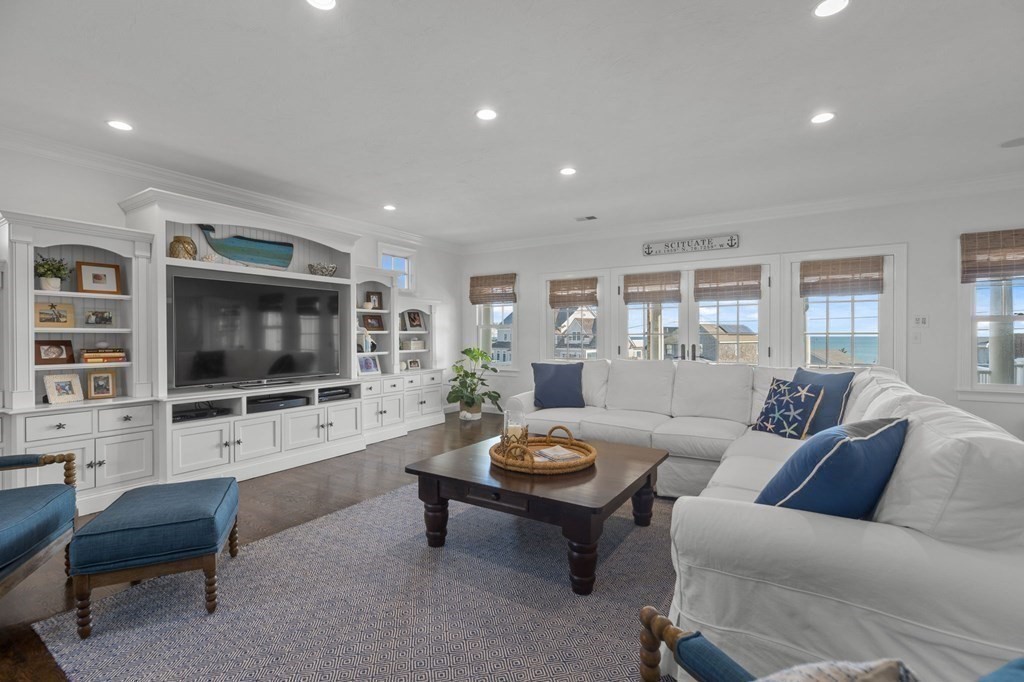 48 Collier Road Scituate, MA 02066 - Photo 23 of 42 a living room with furniture and a flat screen tv