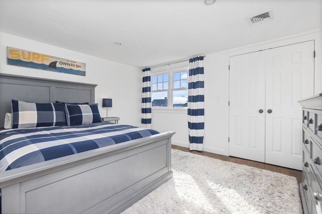 48 Collier Road Scituate, MA 02066 - Photo 25 of 42 a bedroom with a bed and a walk in closet