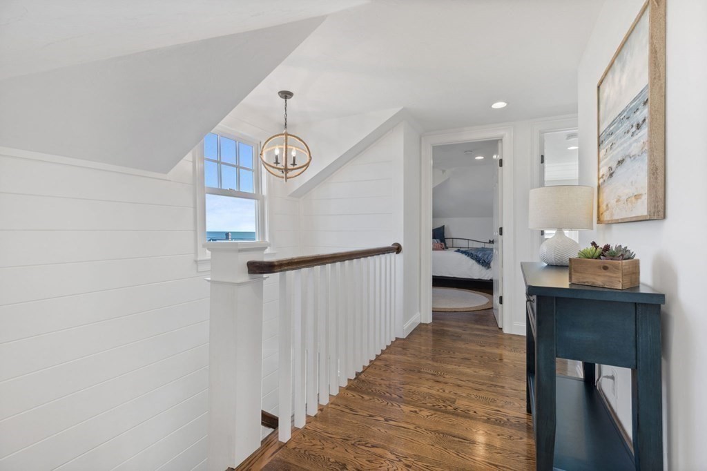 48 Collier Road Scituate, MA 02066 - Photo 28 of 42 a view of a hallway to a livingroom and a dining room with furniture