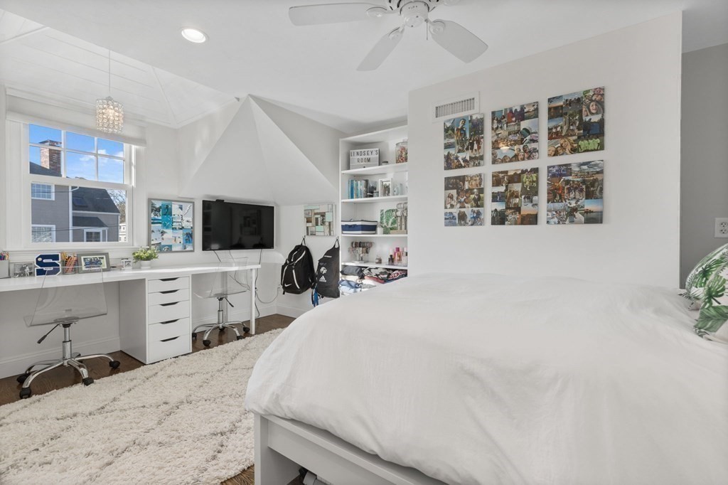 48 Collier Road Scituate, MA 02066 - Photo 30 of 42 a bedroom with a bed and a flat screen tv