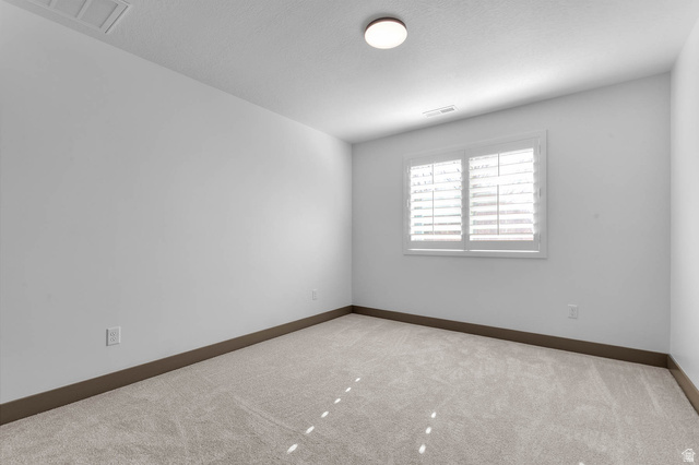 2724 Mt Jordan Road Sandy, UT 84092 - Photo 26 of 33 Carpeted empty room with baseboards