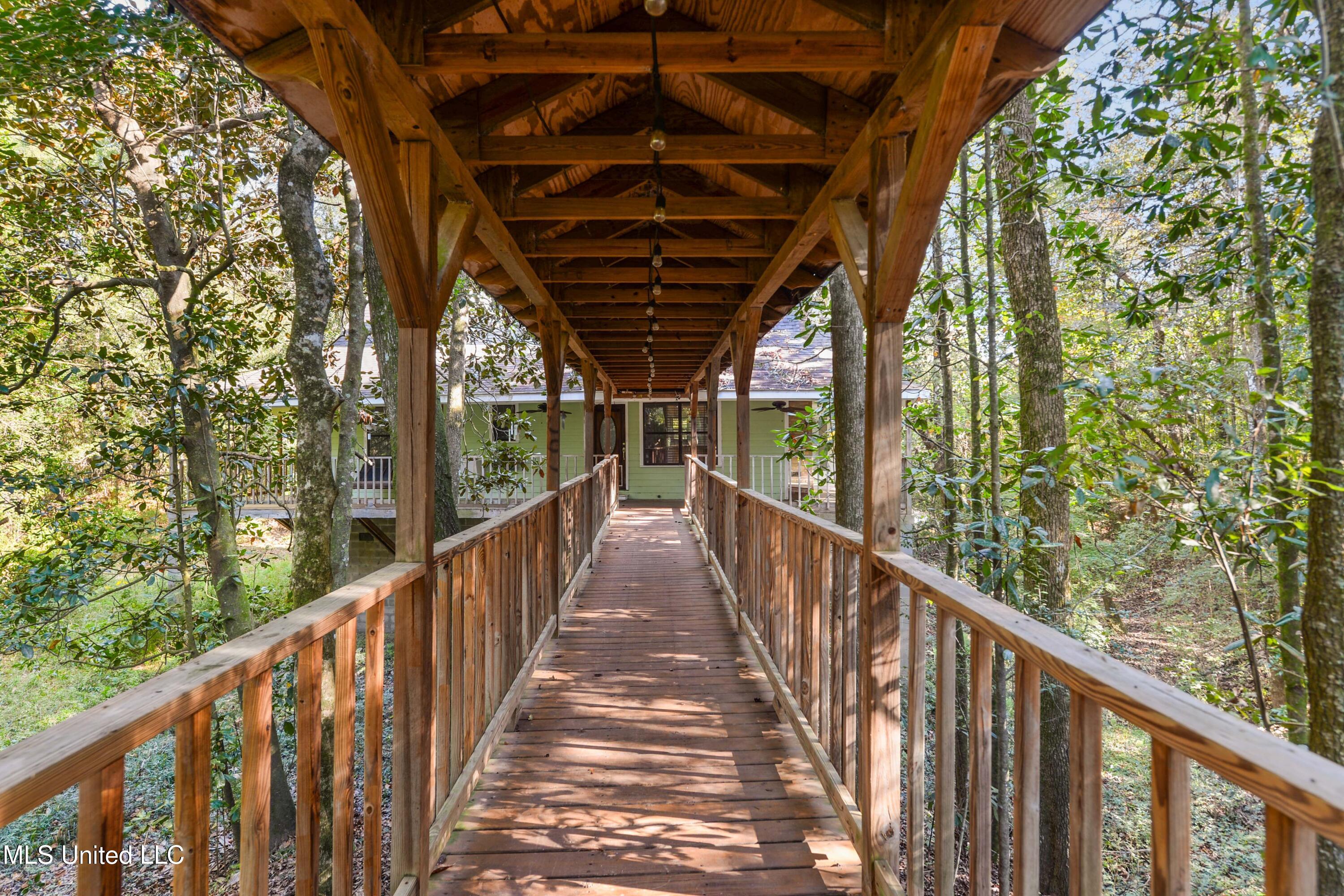 11054 Coleman Road Gulfport, MS 39503 - Photo 2 of 24 Entrance Bridge from Garage