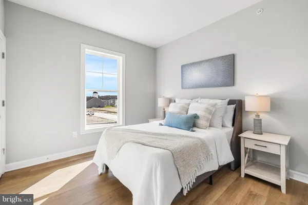 a bedroom with bed and a window
