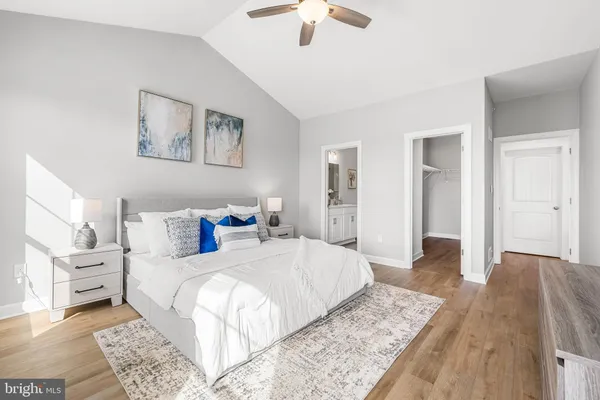 a bedroom with a large bed and a window