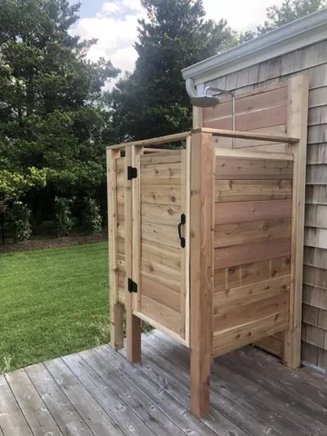 a view of walk in wooden deck and backyard