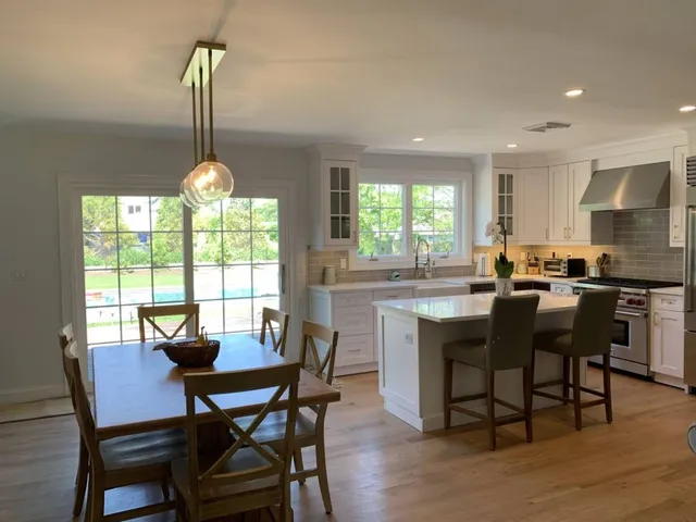 a view of a dining room with furniture window and outside view