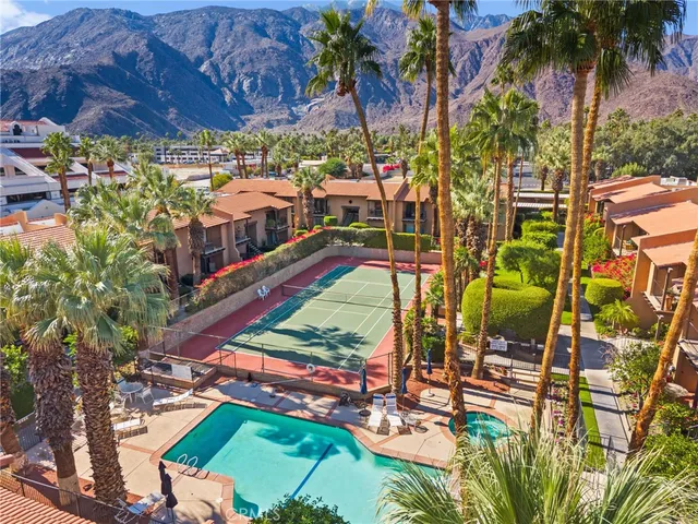 an aerial view of a houses with yard