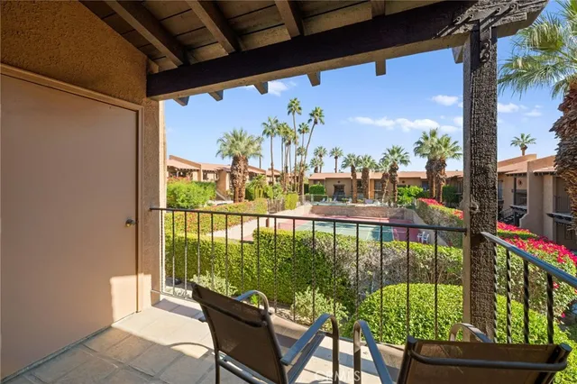 a view of balcony with furniture