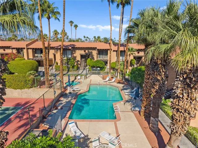 an aerial view of multiple houses with yard