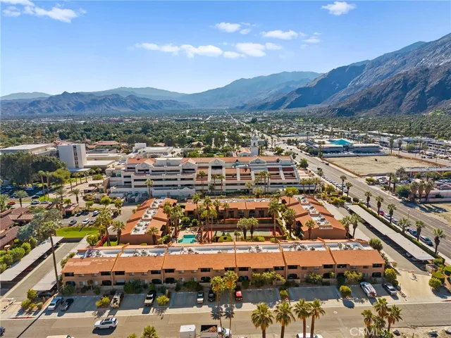 an aerial view of residential houses and outdoor space