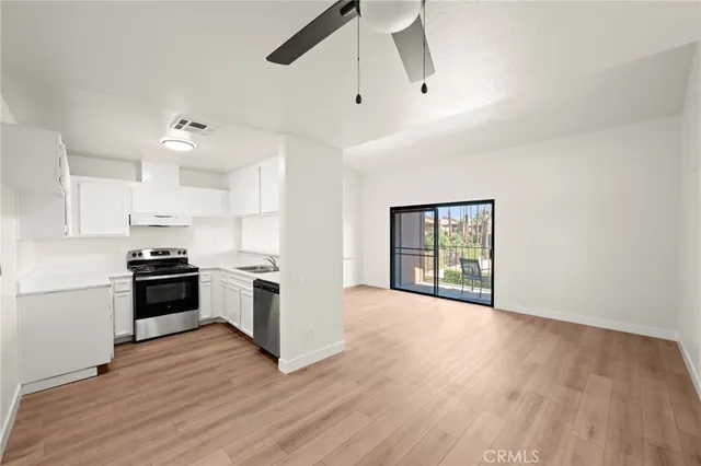 a kitchen with a stove and a refrigerator
