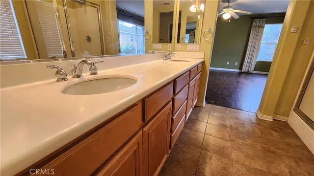 a bathroom with sink a vanity and a mirror