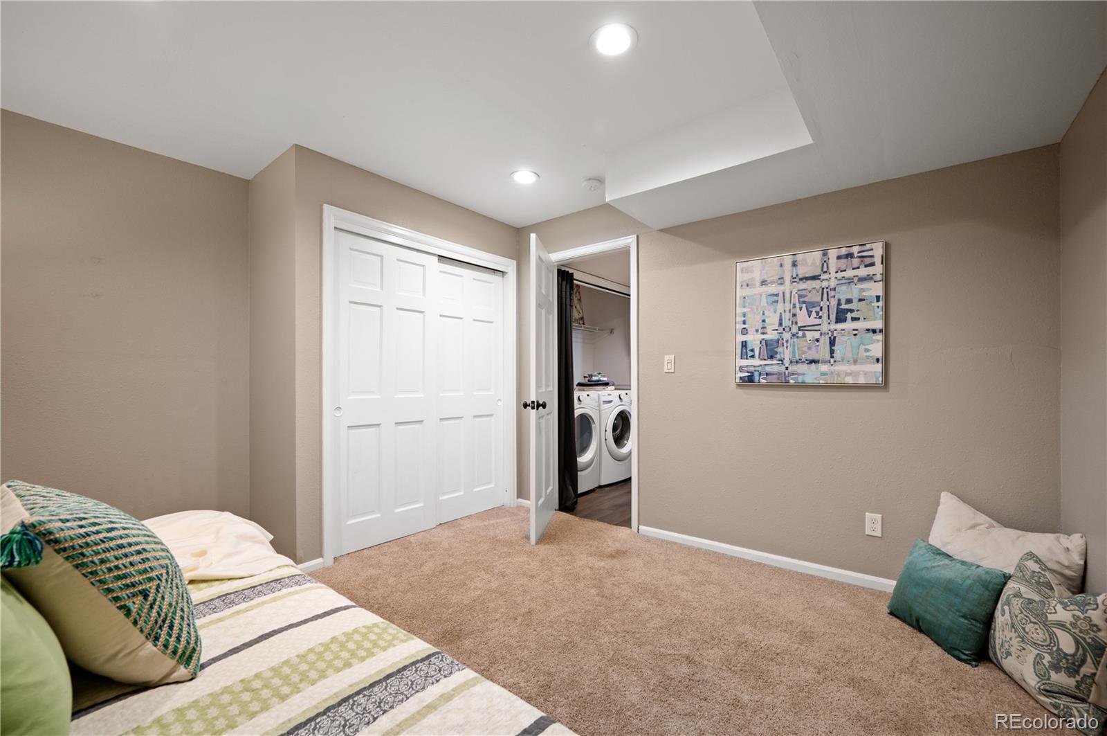 11740 Baca Road Conifer, CO 80433 - Photo 17 of 49 a bedroom with a bed and couch