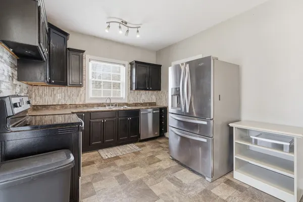 a view of a livingroom with a furniture and windows